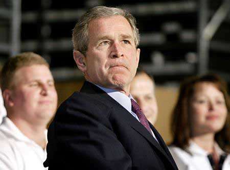 mar8bushtriesnottosmirk