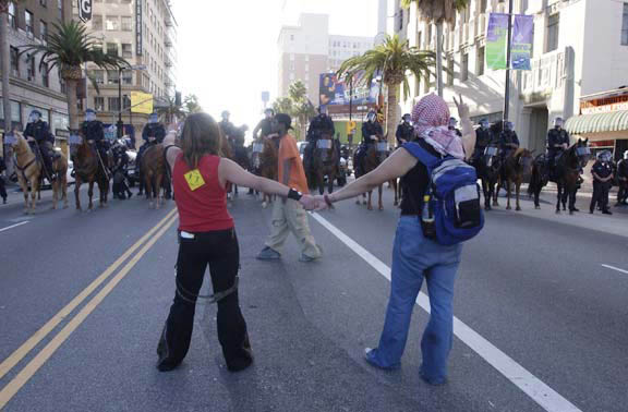 girlsfacepolicehorses
